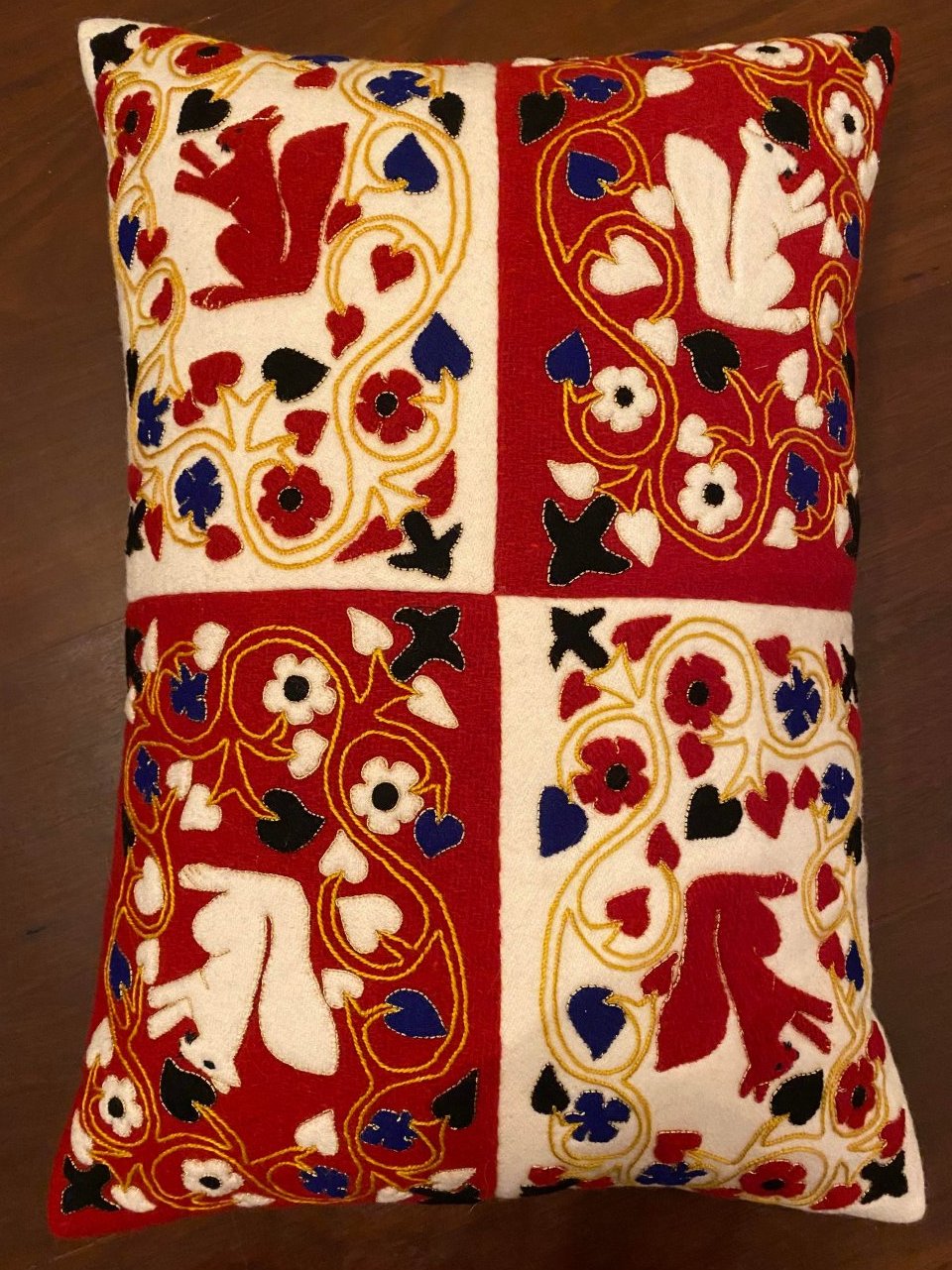 15th century wool applique cushion with squirrels